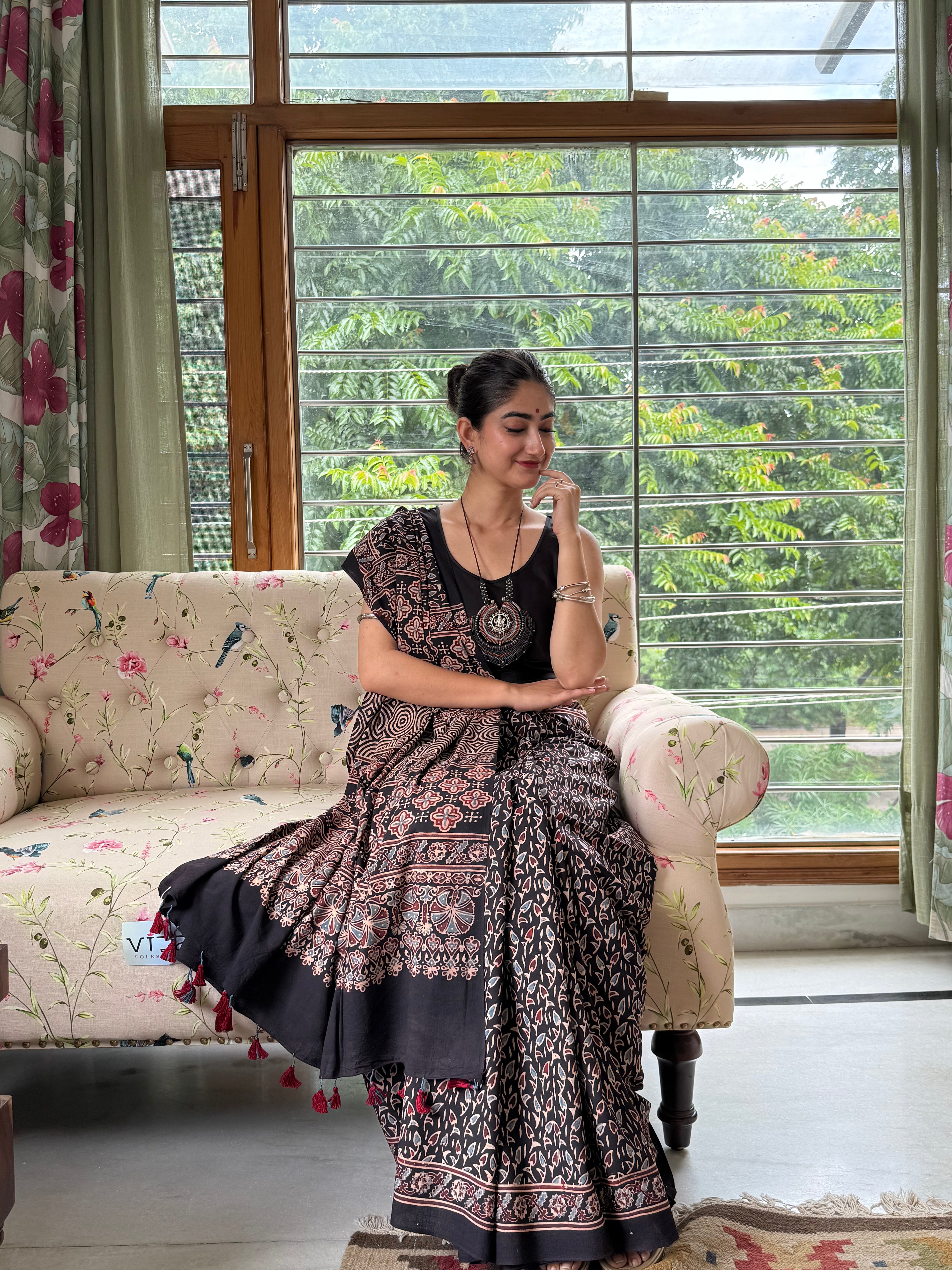 Traditional Ajrakh block print details on black cotton fabric