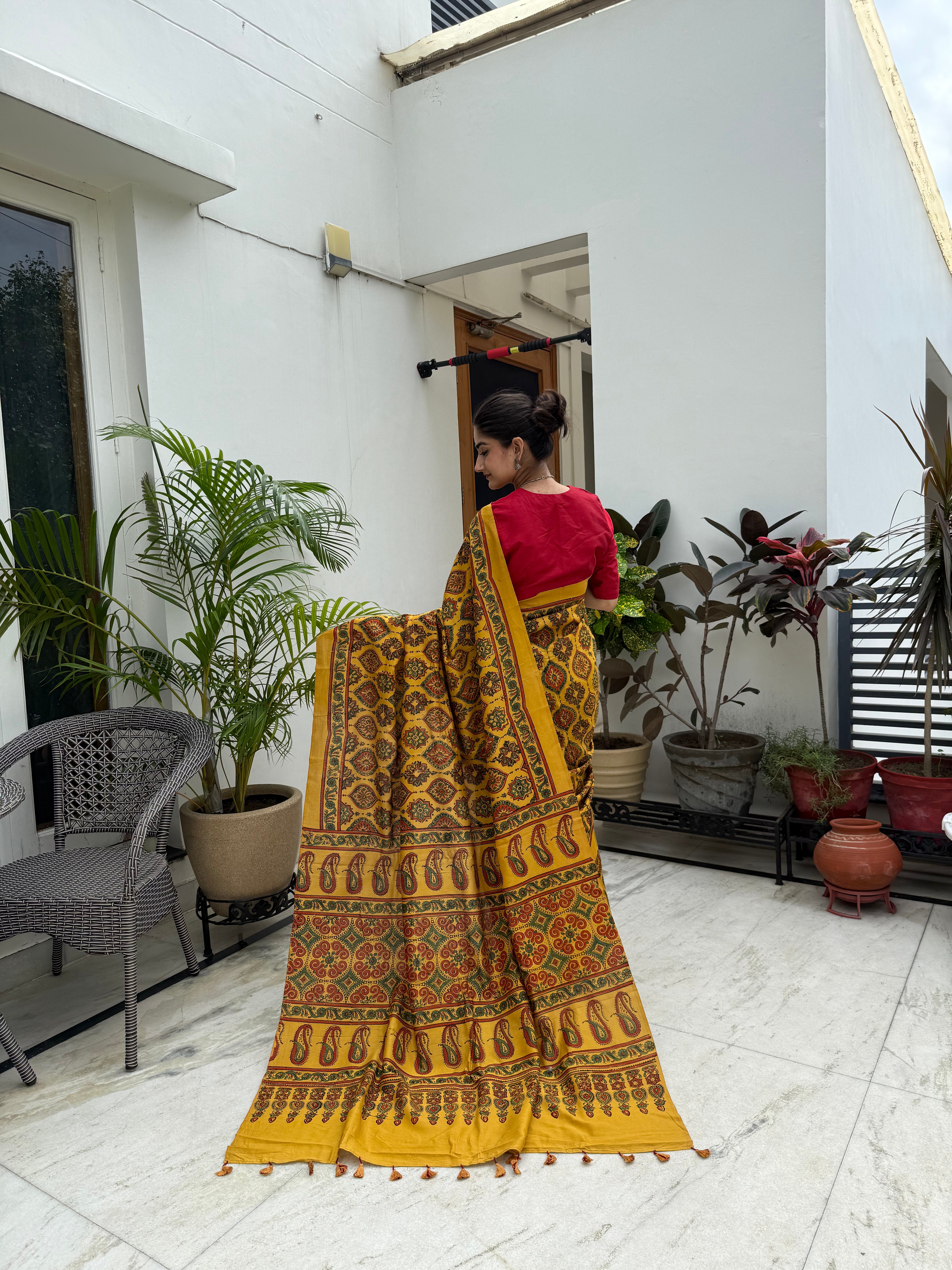 Elegant mustard Ajrakh cotton saree styled traditionally
Mustard with Maroon-Green Ajrakh saree perfect for office and festive wear