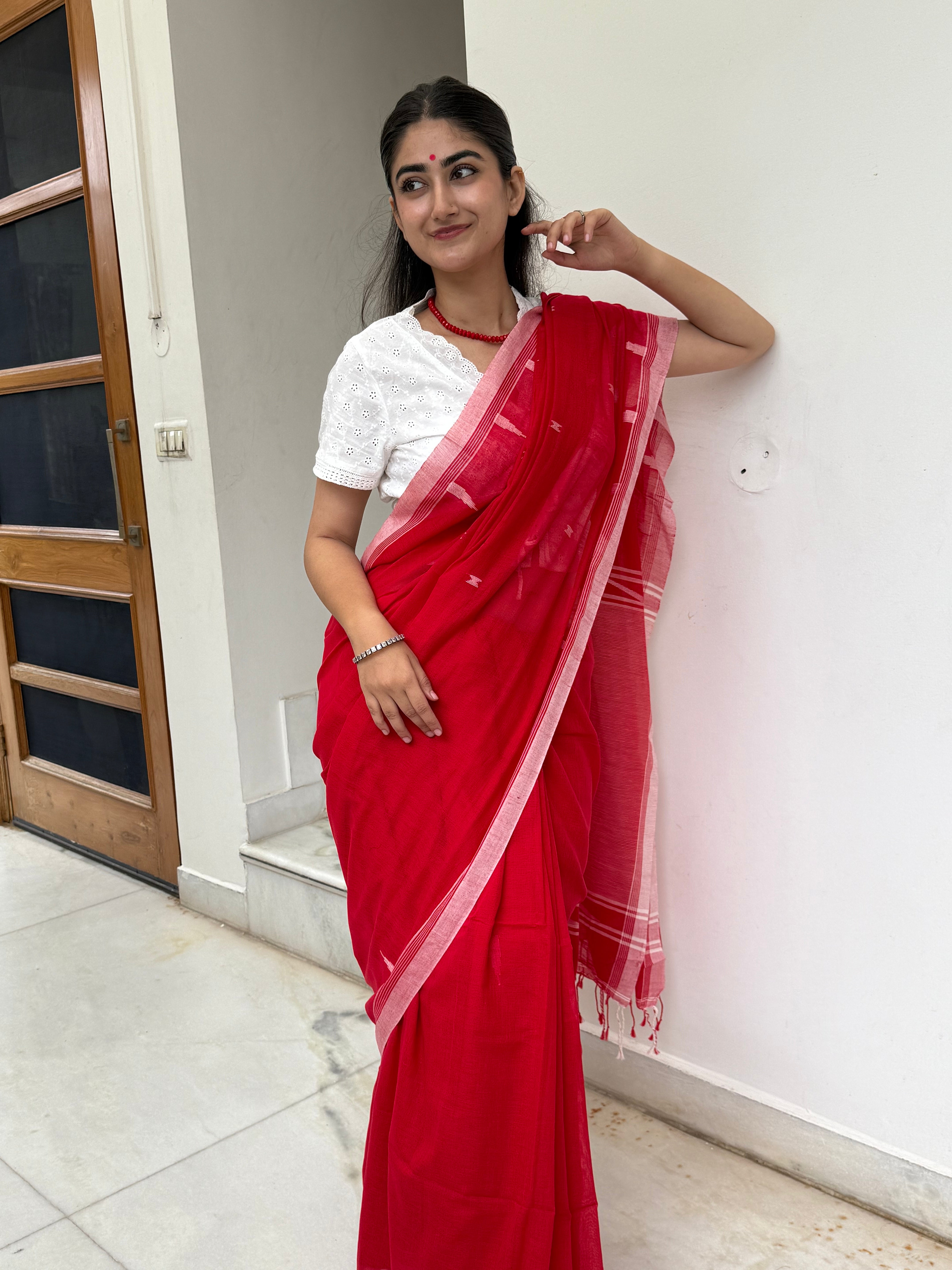Red Bengal cotton saree highlighting temple weaving bor