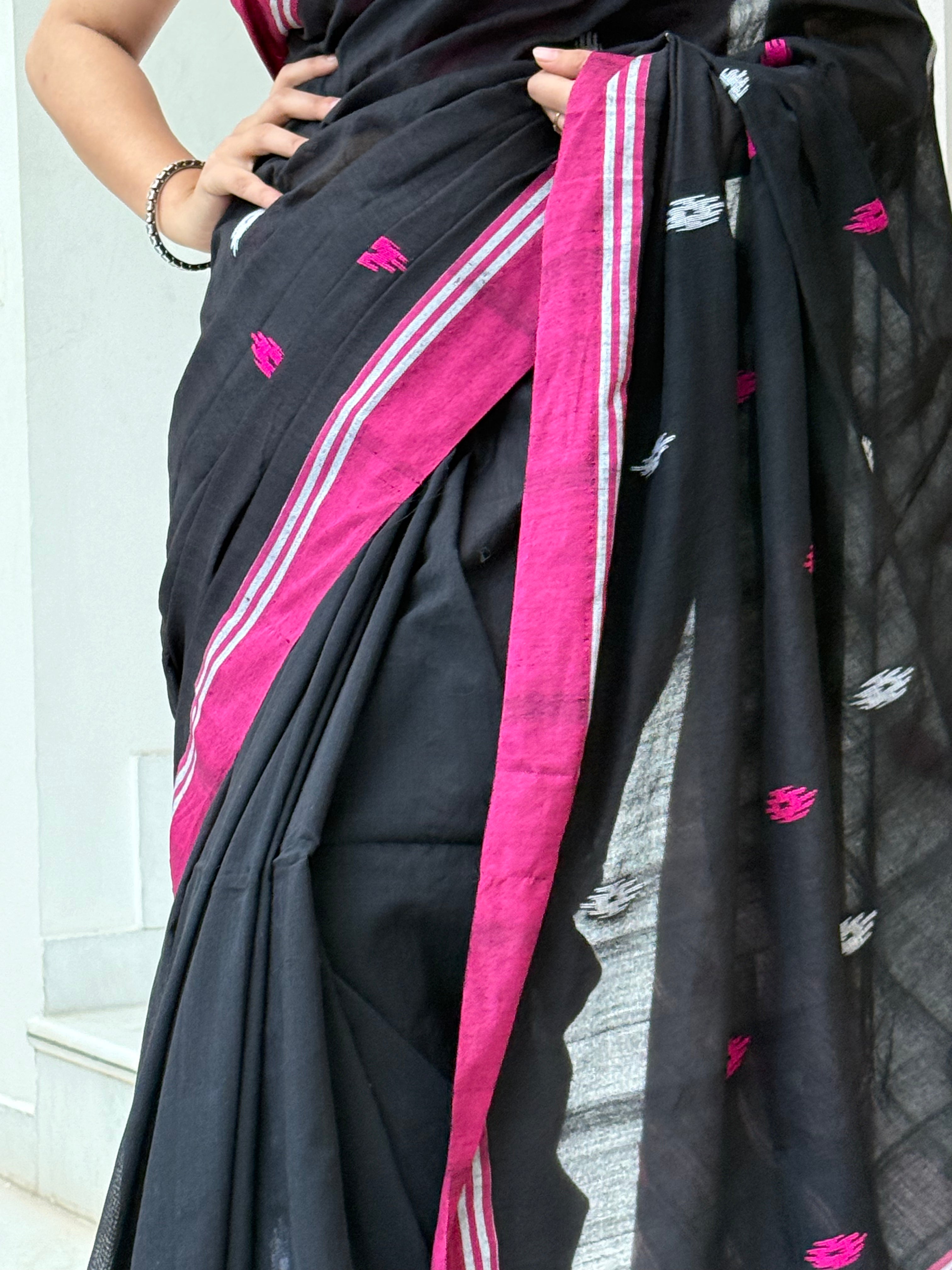 White and pink buti motifs with pink border on black cotton fabric