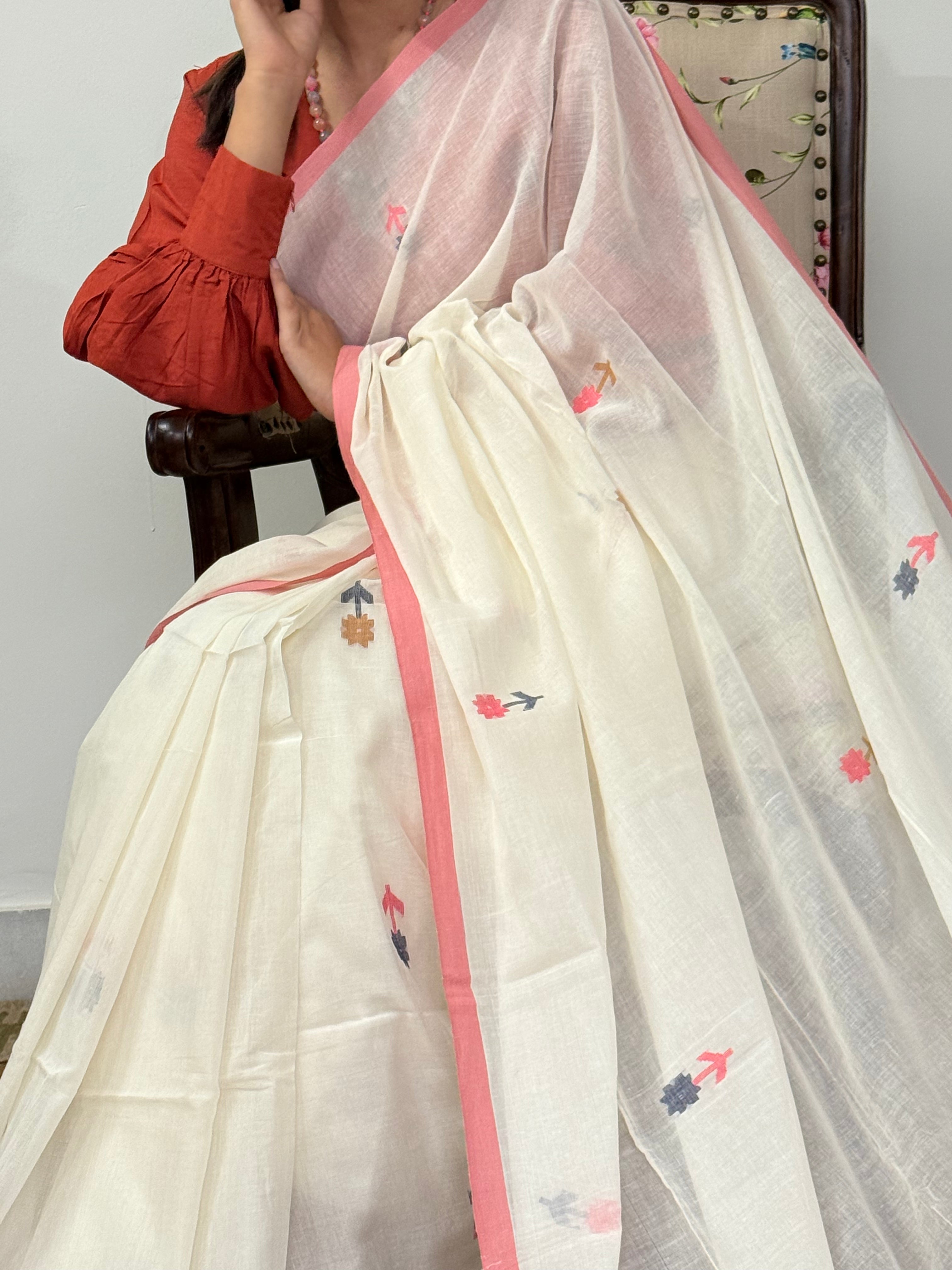 Detailed flower weave buti motifs on off-white mul cotton fabric