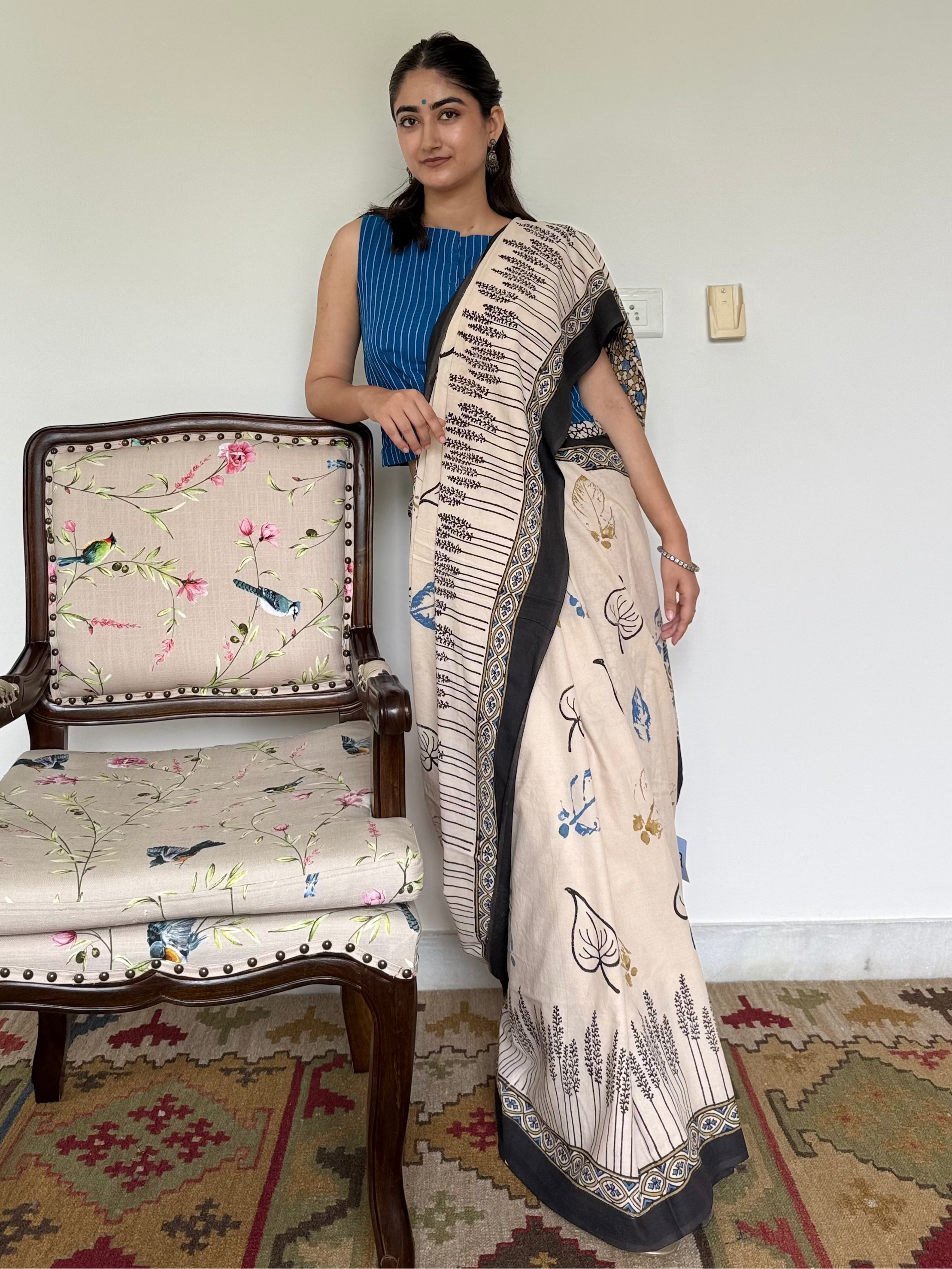  Intricate Ajrakh block prints in black on beige cotton fabric
