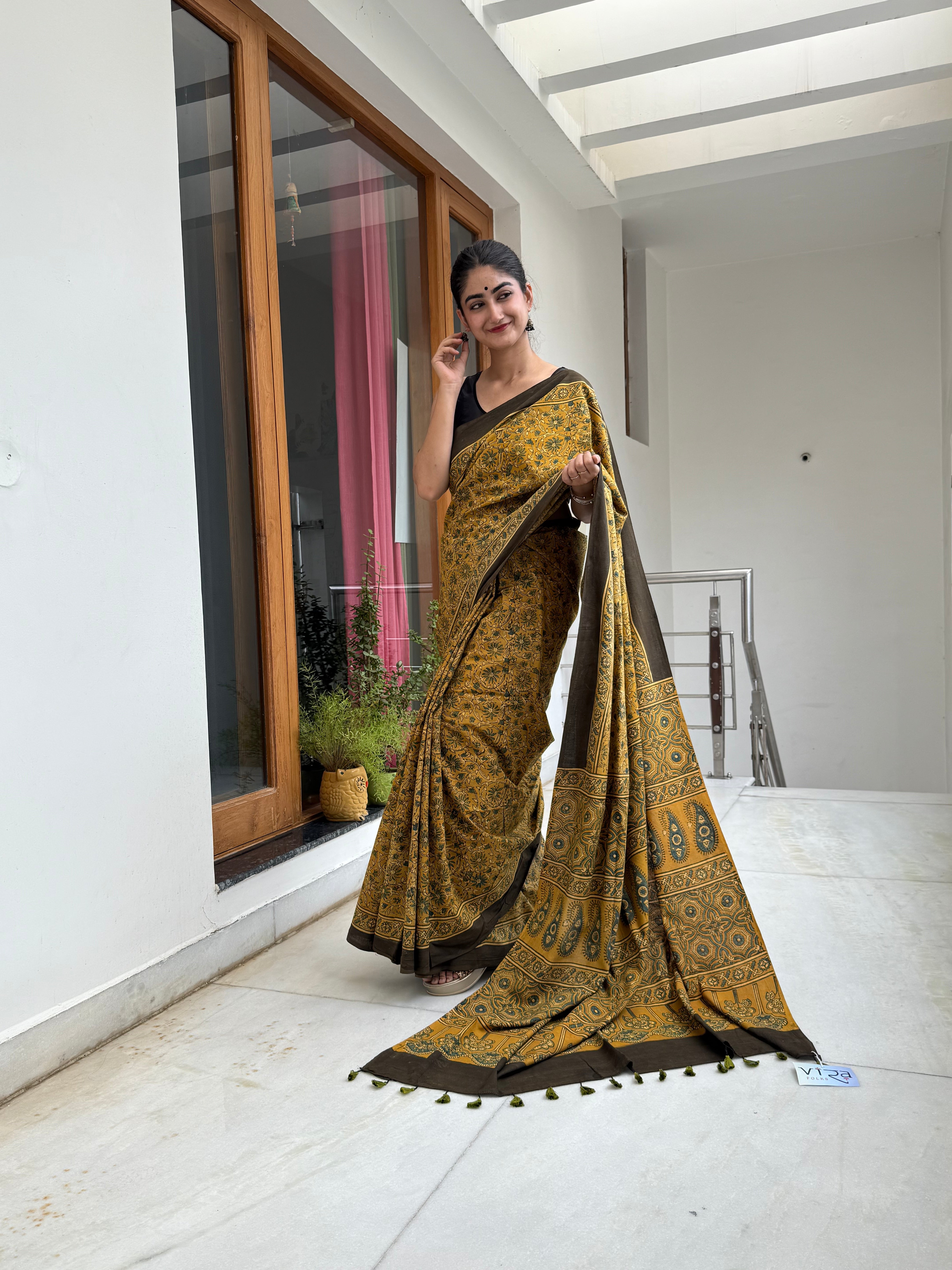 Earthy Mustard Pure Cotton Ajrakh Hand Block Saree draped on model 

Traditional Indian Handcrafted Ajrakh Cotton Saree for Festive Wear