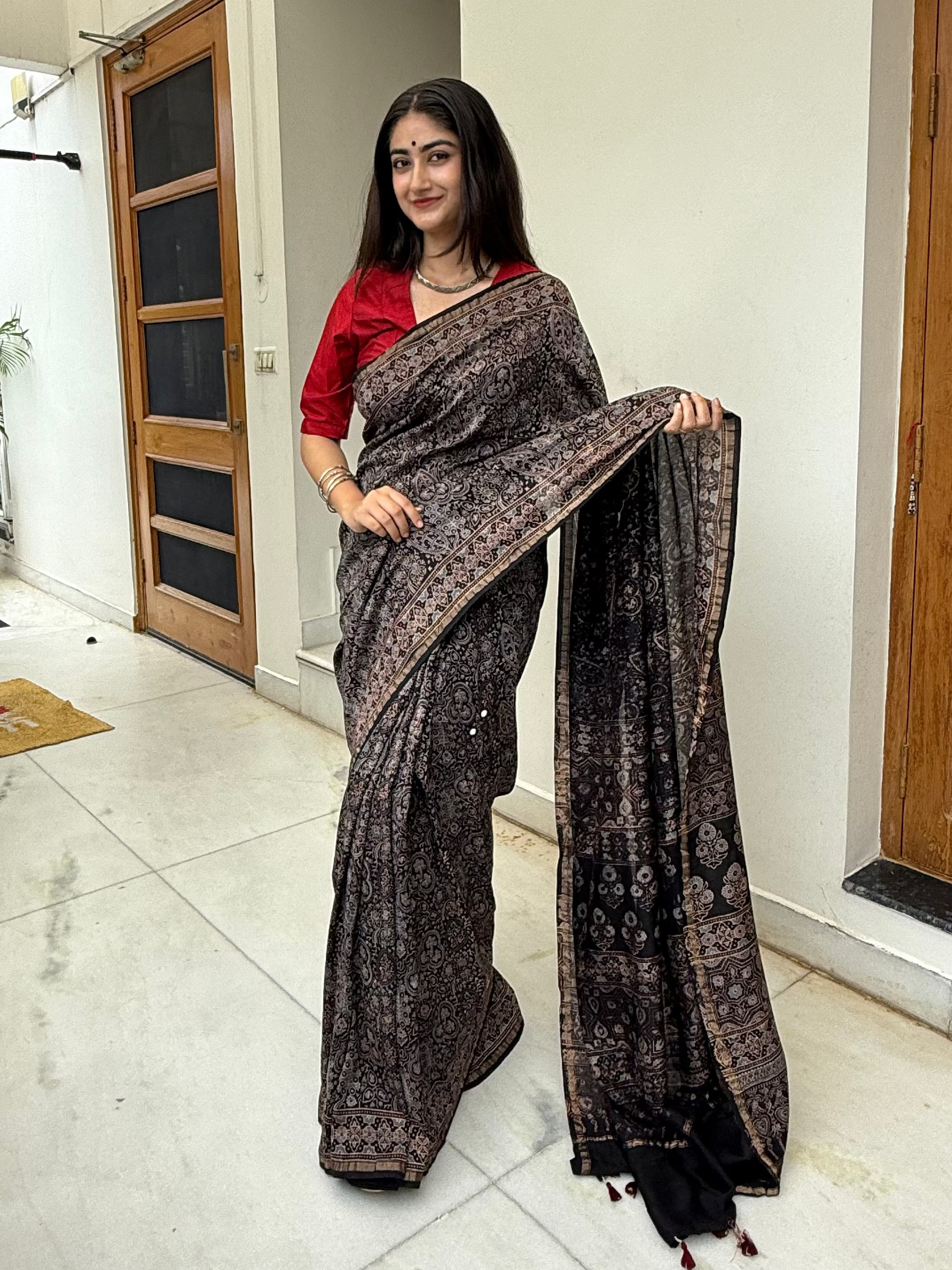 Royal Black Ajrakh Chanderi Saree Styled Elegantly
Occasion shot: Traditional Festive Mirror Work Ajrakh Chanderi Saree