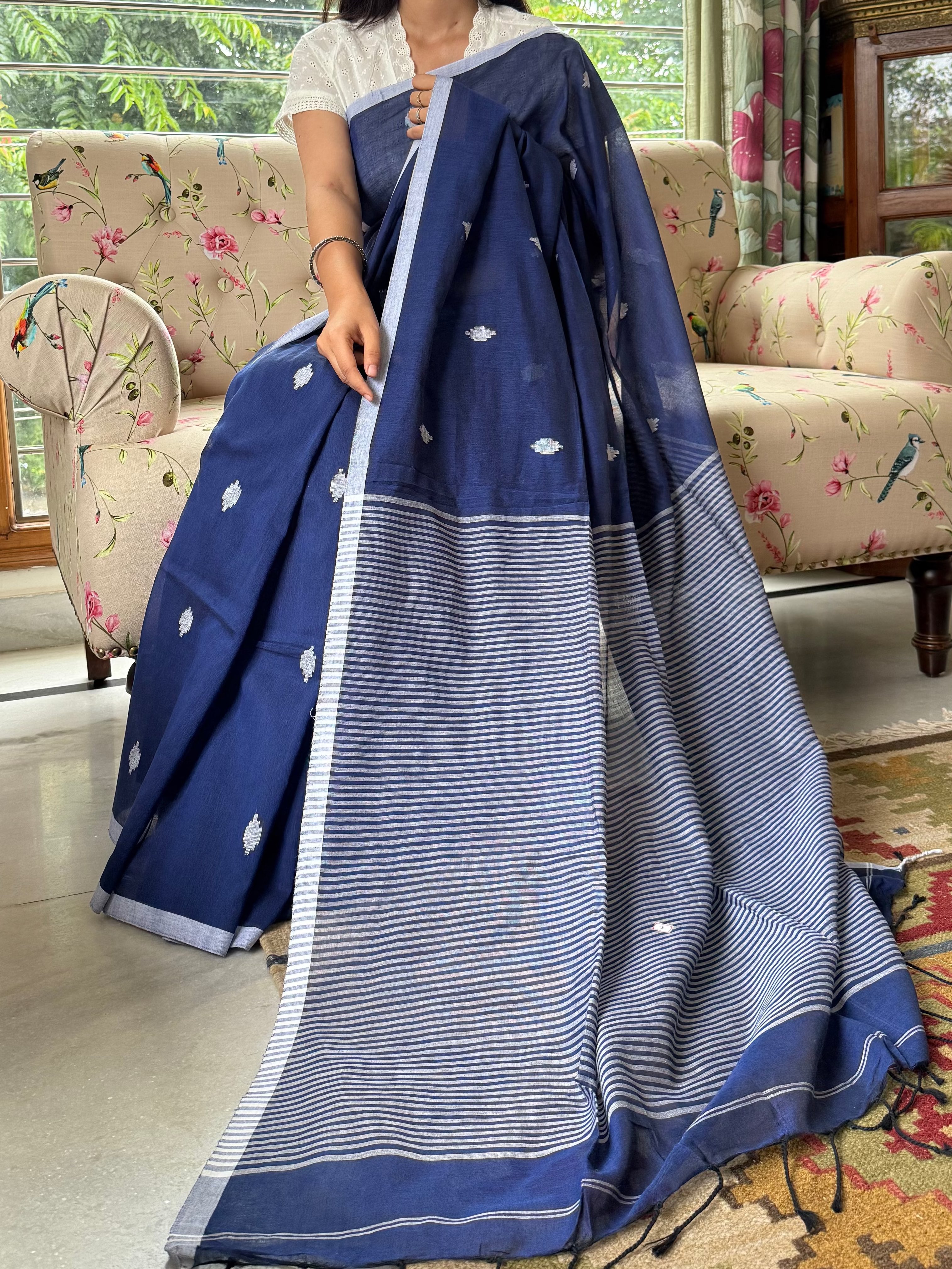 Elegant blue and white cotton saree styled for office or casual wear