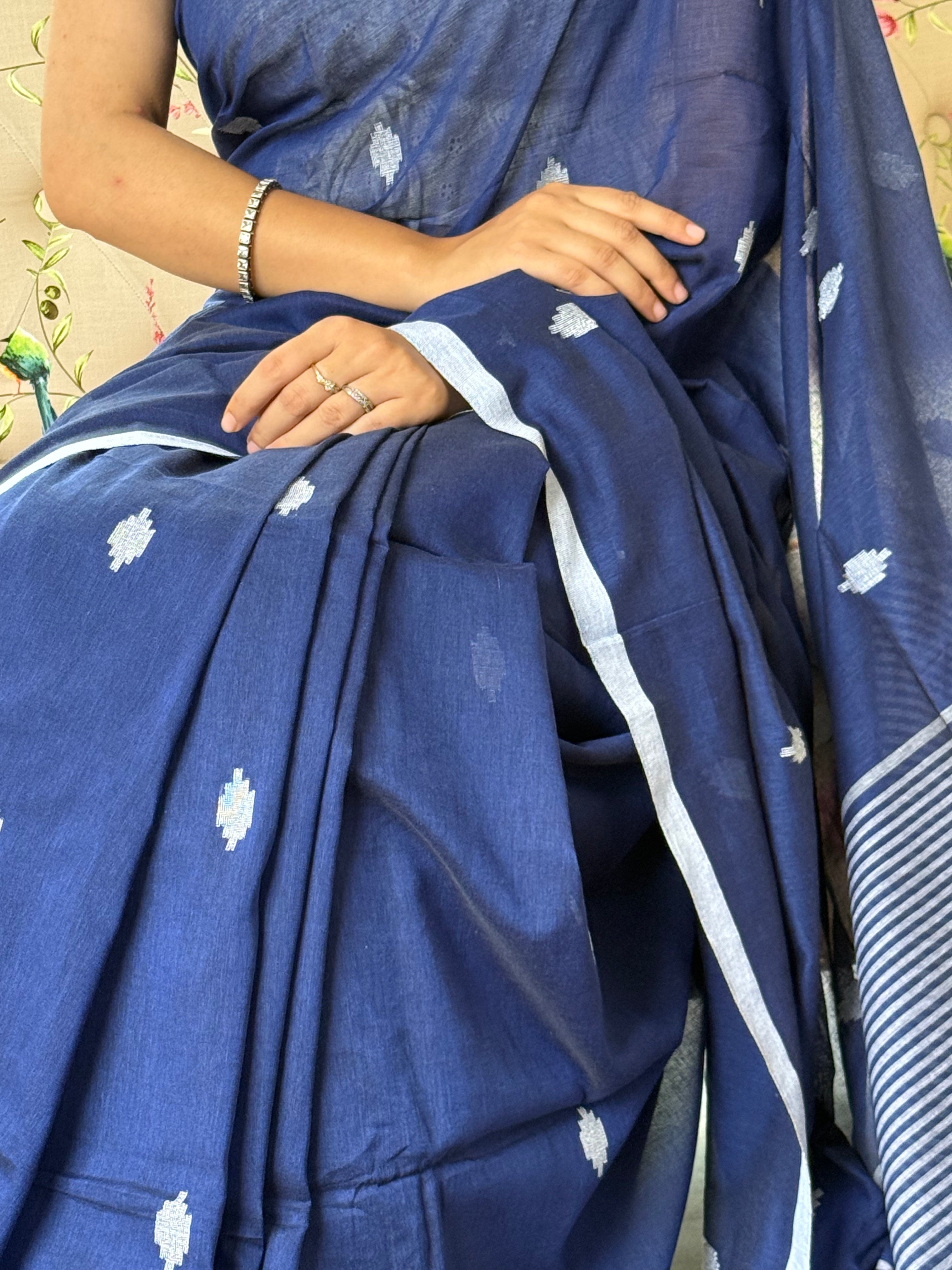  Soft, breathable pure cotton weave
Blue pure cotton saree with white buti and striped border design