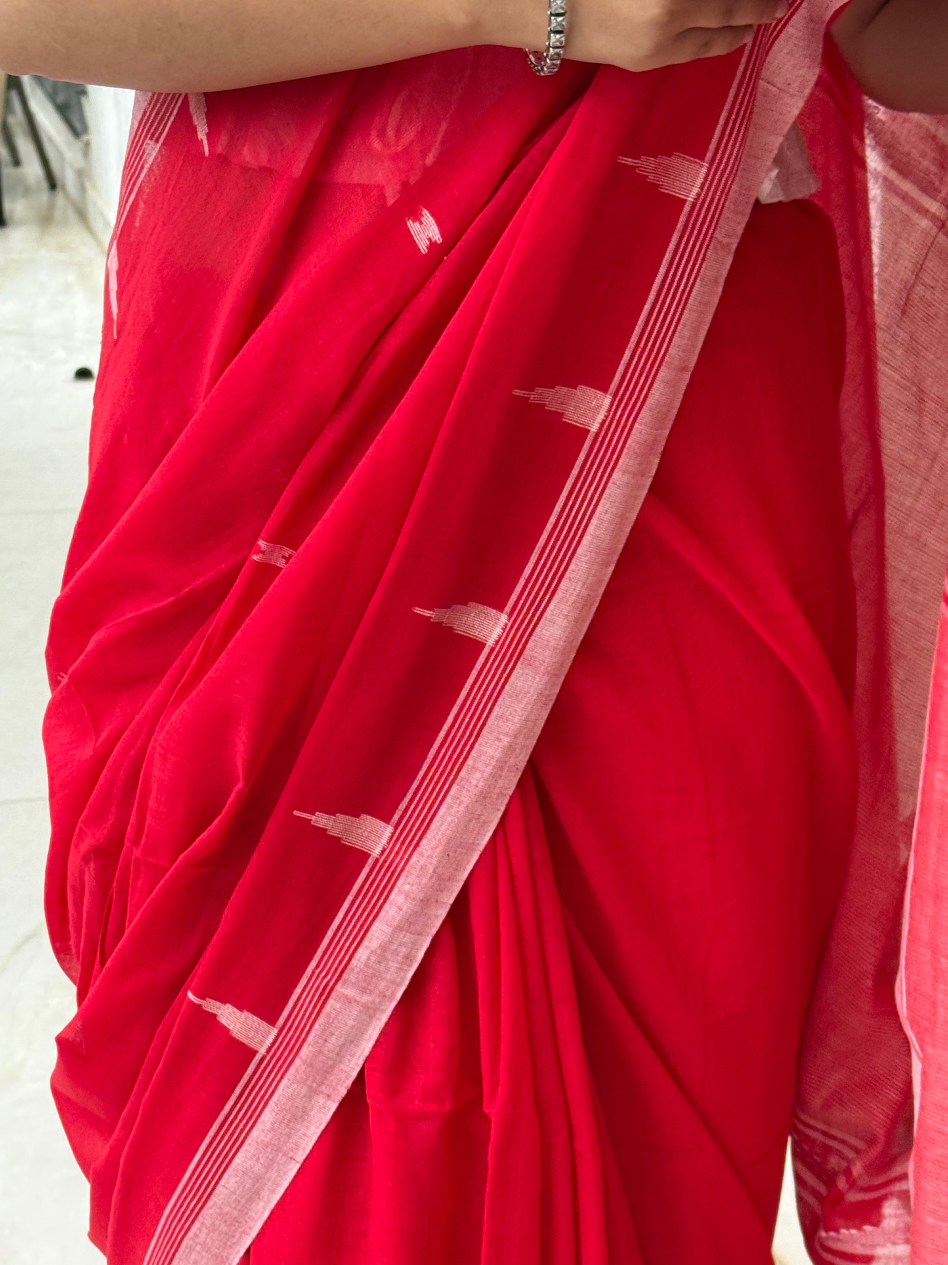 Detailed temple weaving on red Bengal cotton saree border
