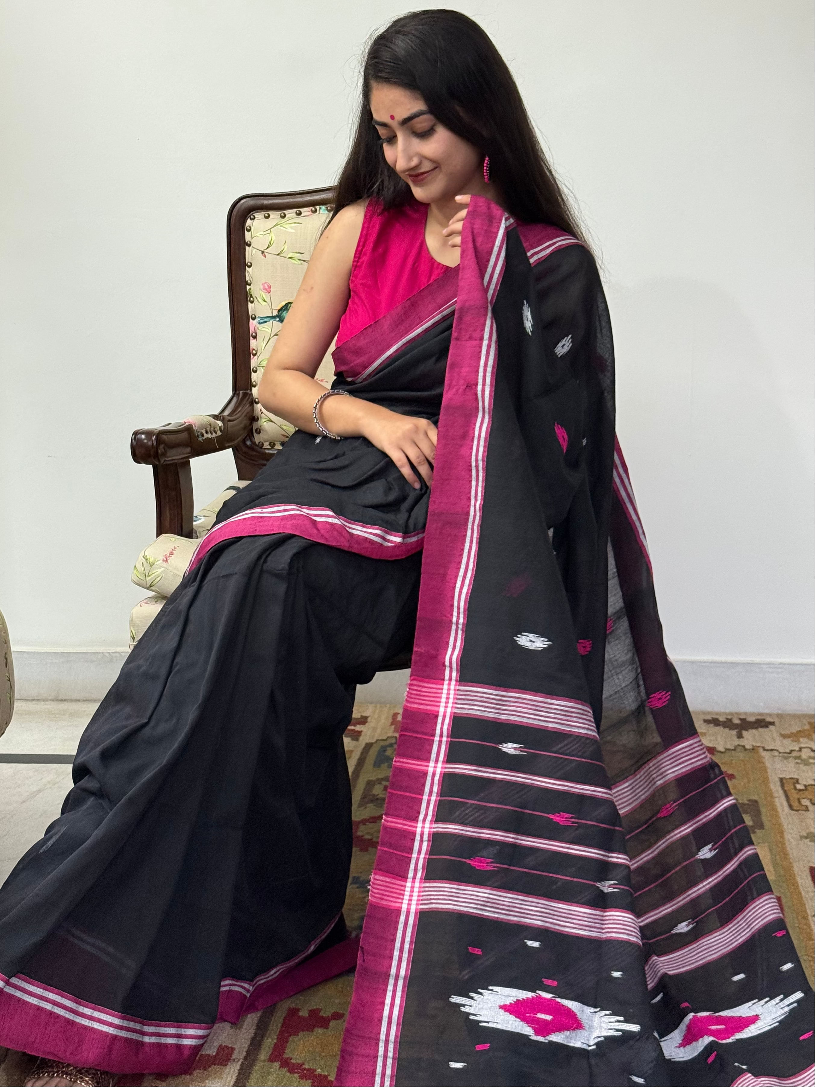  Elegant black saree with pink border styled for office or casual wear