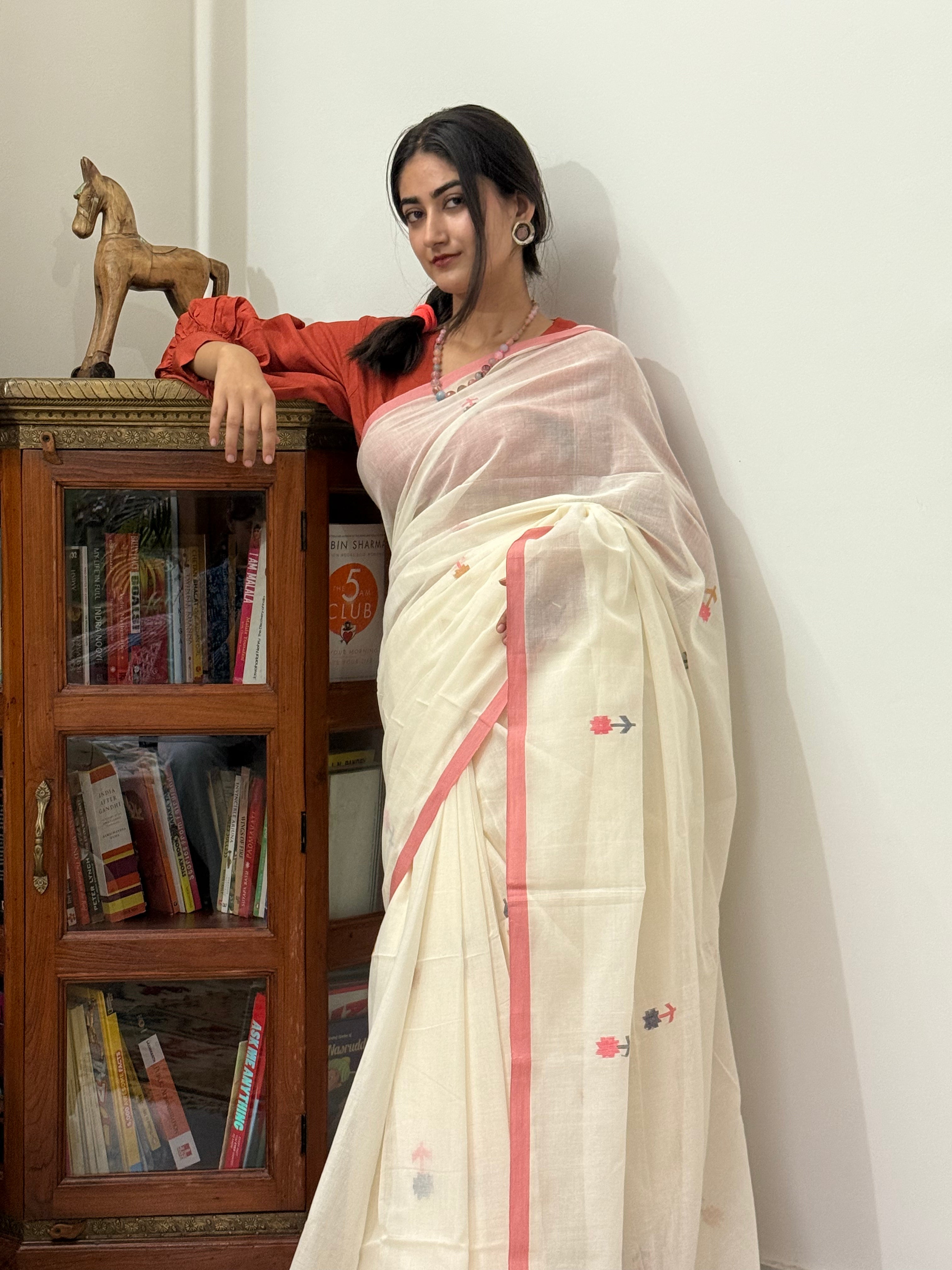  Off-white mul cotton saree showing flower weave buti design