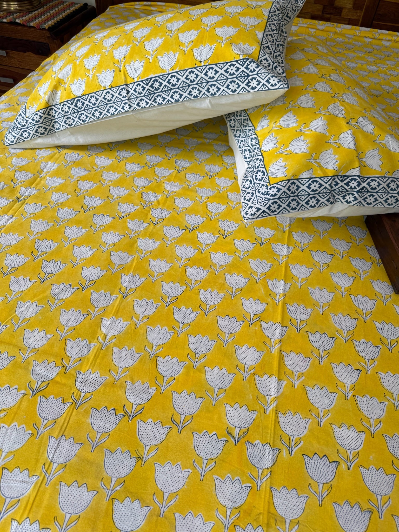 Yellow Floral Cotton Bedsheet with Blue Border