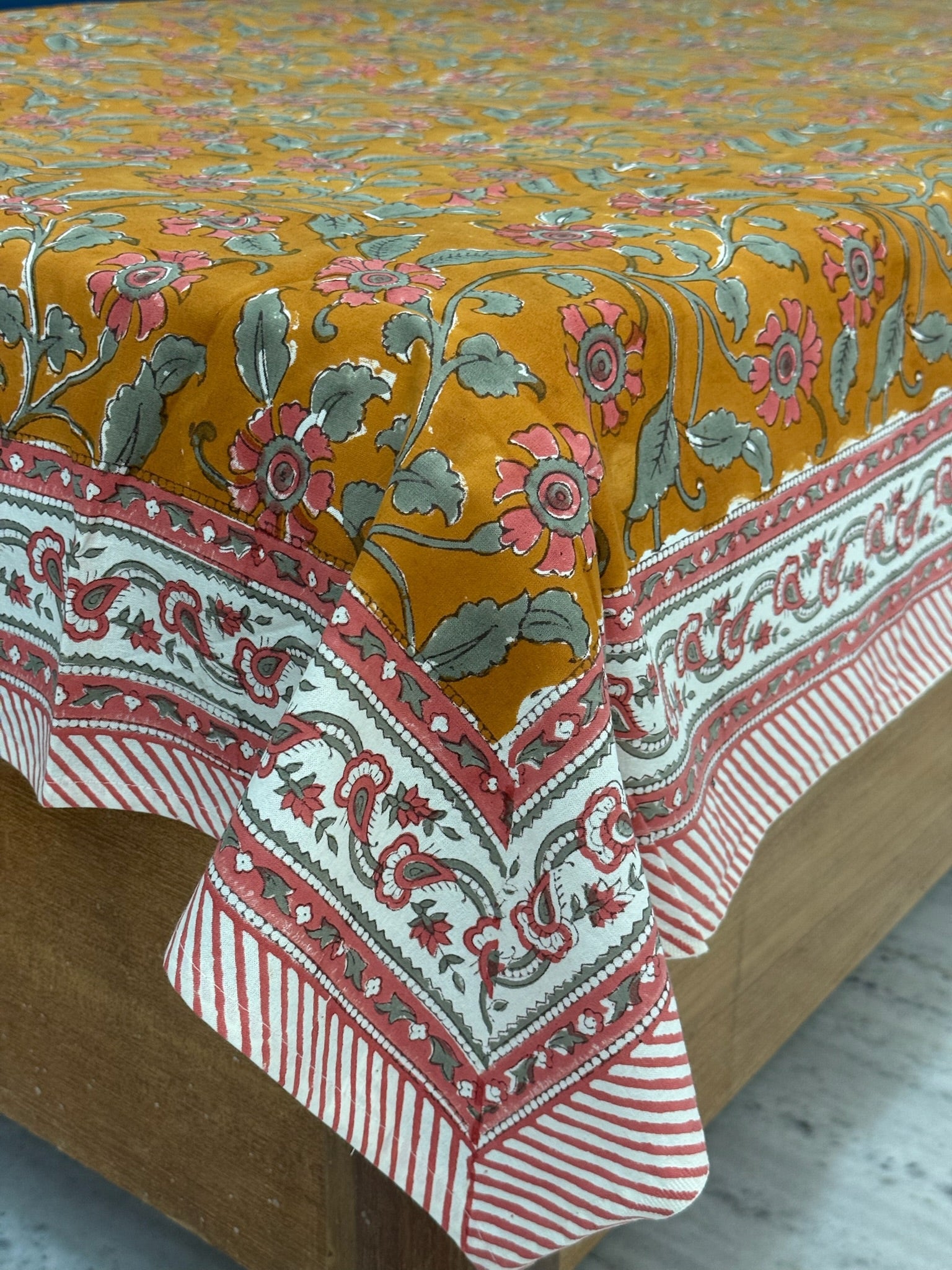 Mustard Floral Cotton Bedsheet with Red Border