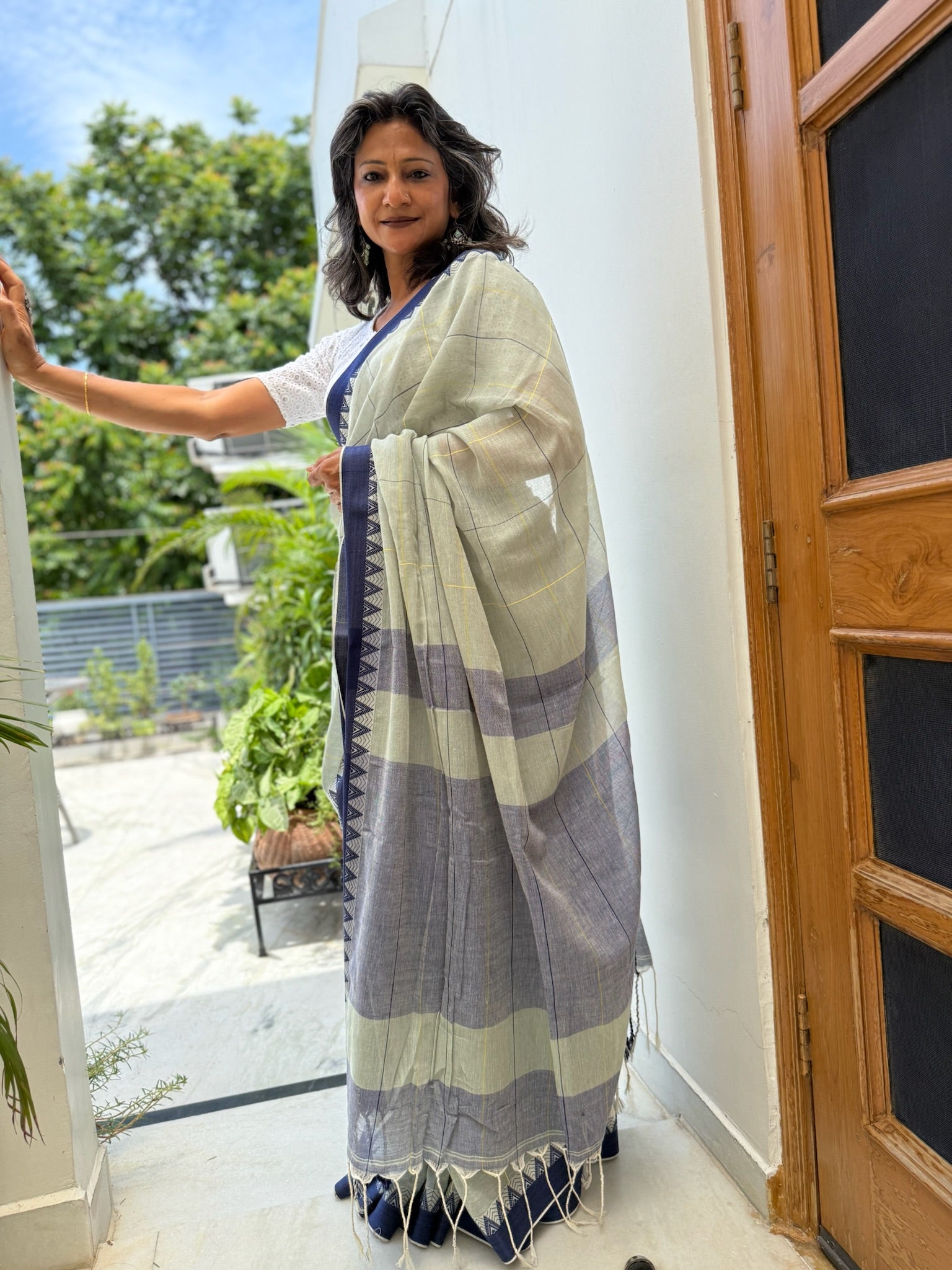 Elegant blue Cotton Saree with check and temple border