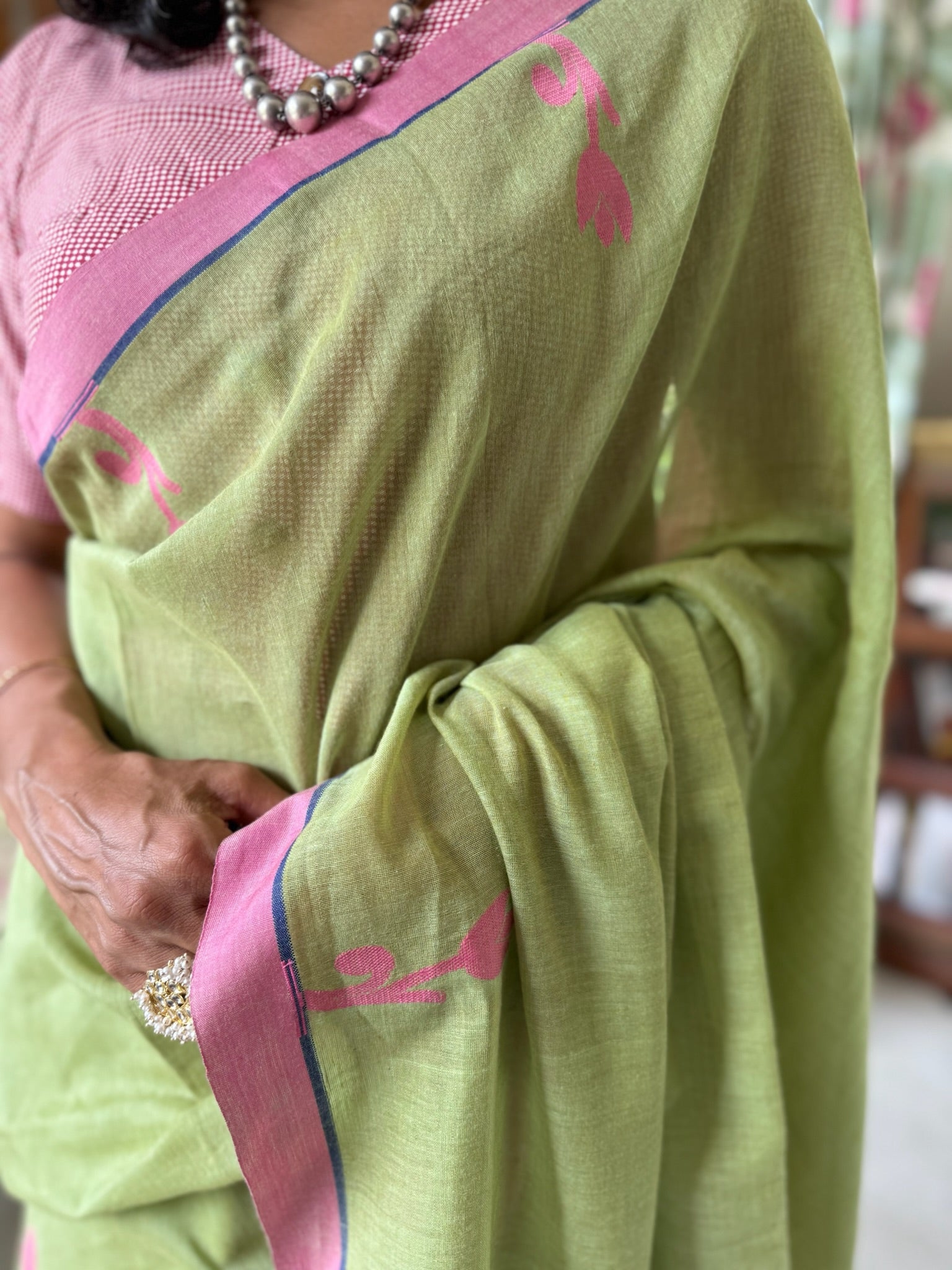 Soft Olive Green Paired With A Dusty Rose Pink Pallu Pure Cotton Jamdani Saree